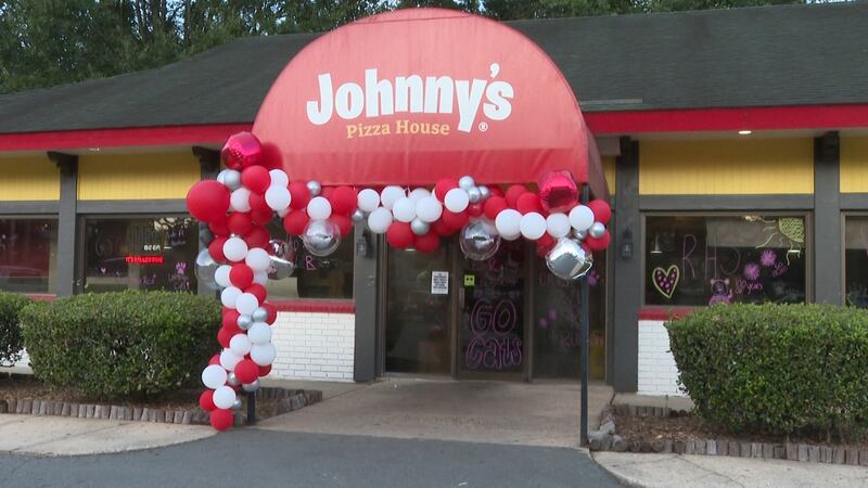 High school cheer teams decorate Johnny's Pizza House for game day! The school spirit...