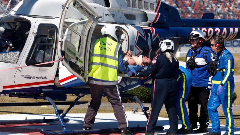 Driver Jordan Anderson is loaded into a helicopter after a fiery crash during the NASCAR...