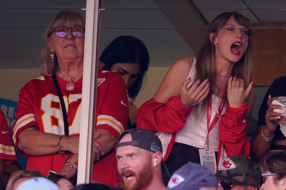 File - Taylor Swift, right, watches from a suite alongside Travis Kelce's mother, Donna Kelce,...