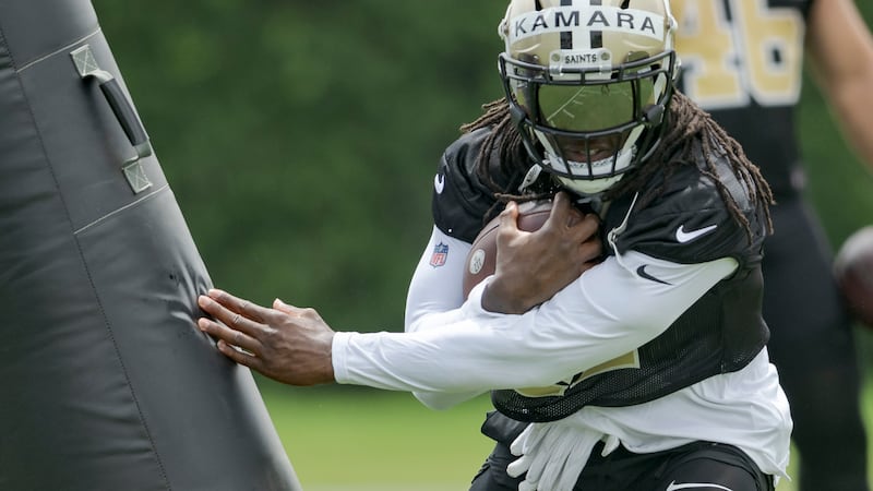 New Orleans Saints running back Alvin Kamara (41) runs during an NFL football practice in...